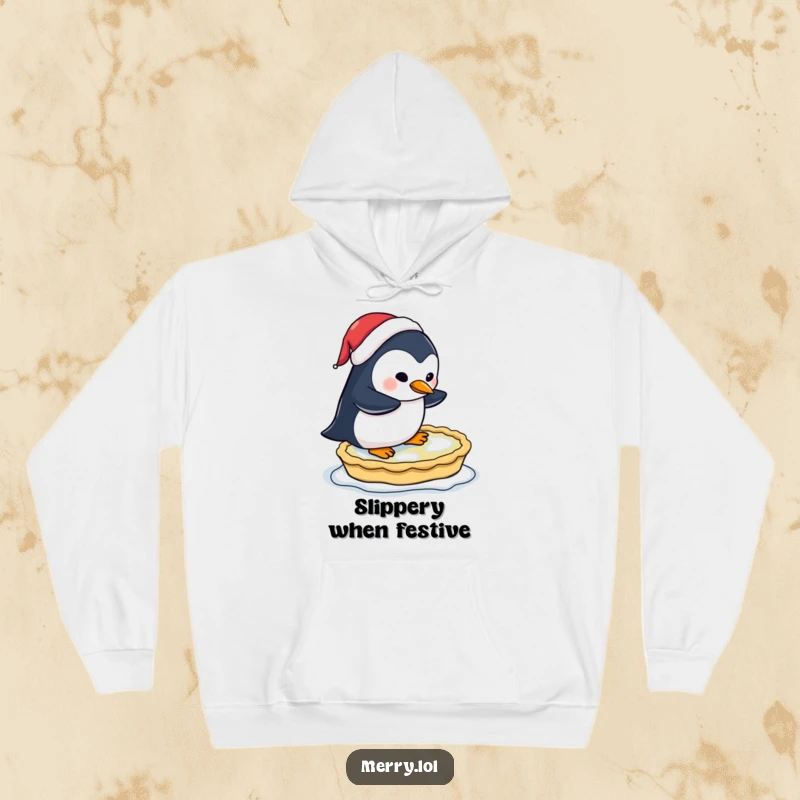 Funny hoodie design of a penguin wearing a Santa hat comically attempting to ice skate on a frozen pie, festive and warm.