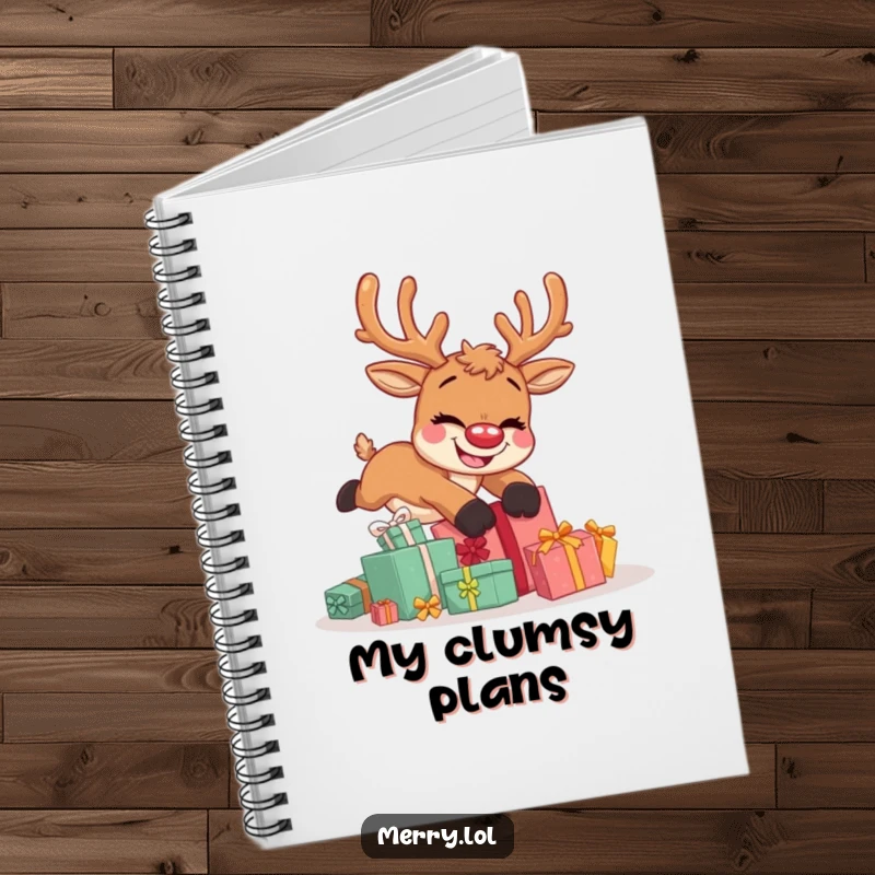 Funny notebook featuring a cute reindeer character mid-fall over Christmas presents with a wide, goofy grin on its face.